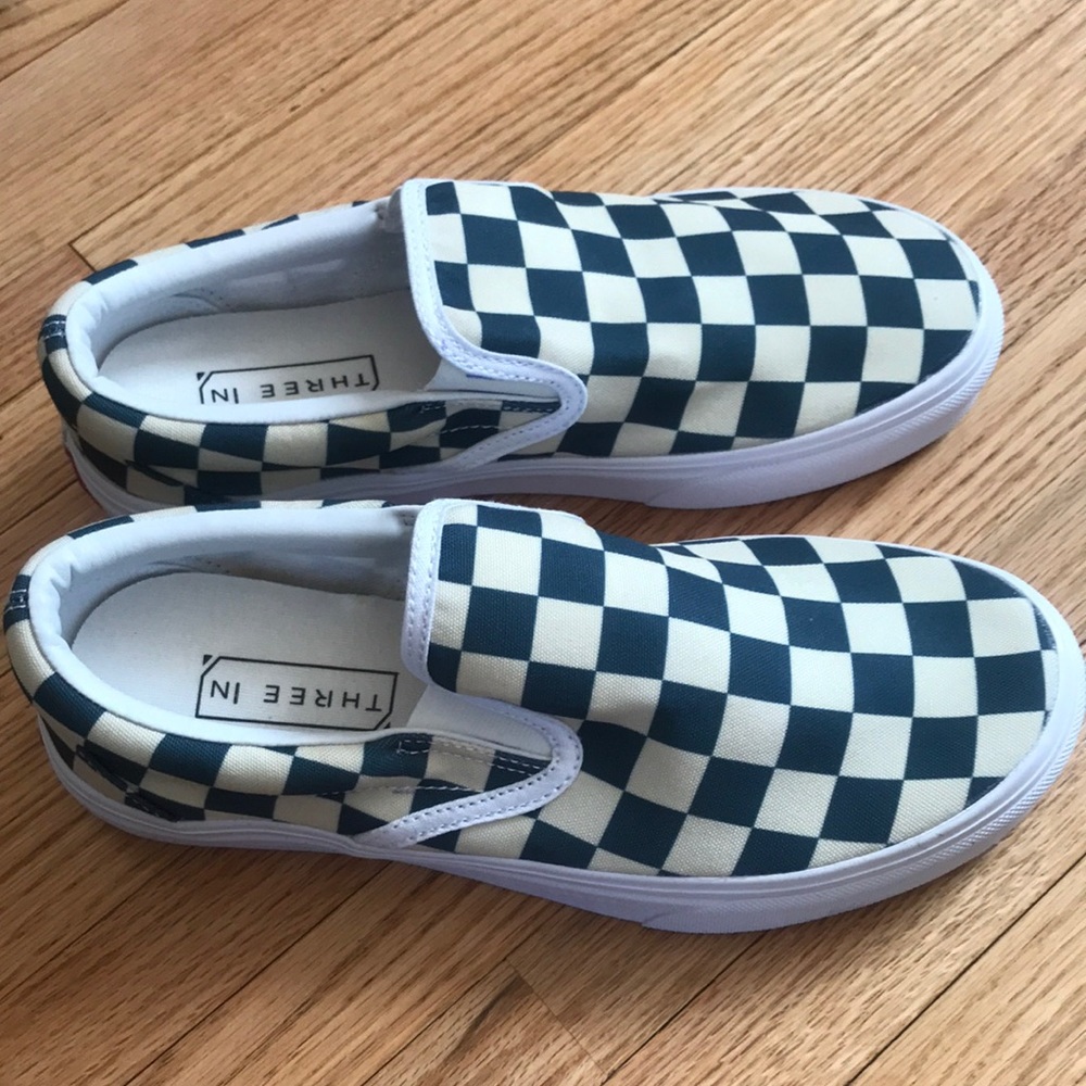 Three In women checkerboard slip on shoes.